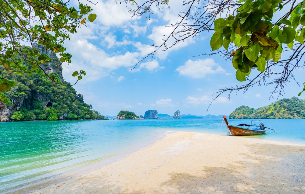 Beach,And,Long-tail,Boats,Moored,Along,The,Sandy,Beach,In
